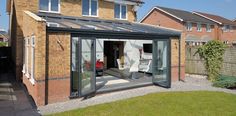 an image of a house that is in the process of being renovated with glass doors