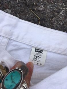 "Beautiful vintage 1990s Levis 517 jeans. 100% cotton denim in classic white. So good for a monochrome white outfit or pair with a vintage chambray top. These can be dressed up or down easily depending on how you style them. 517 model, slim fit boot cut. Made in USA. High waist hits slightly below belly button- not as high as an early 90s ribcage fit. Slim leg with slight flare at hem, more versatile than a full bell bottom. Vintage size 5 jr M. Fits estimated modern XS/S depending on desired fi Cheap White Levi's Jeans, Monochrome White Outfit, Levis 517, Jeans Mid Rise, Chambray Top, White Outfit, Early 90s, Bell Bottom, Slim Leg