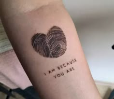 a person with a tattoo on their arm that says, i am because you are