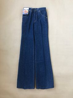 Lee Bootcut Jean from the 70s with original tags still attached Sized W29 L34 in 100% washed cotton denim, Made in Belgium  Mid to high rise with a bootcut leg Talon 42 zipper, front and back pockets Unworn, originating from the archive of a closed down jeans shop Measurements To help make sure the item will fit; use a soft tape measure and compare these with your own or on an item in a similar style. These measurements are just a guide, if you are uncertain please contact us with your measurements and we can advise best fit. Waist: 38cm x 2 Front rise: 28,5cm  Seat: 46cm x 2 Inseam: 90cm Dimensions are taken with the item laying flat on a smooth surface and stretching it out to its full width and length. Retro Fitted Full-length Flare Jeans, Fitted Full-length Retro Flare Jeans, Fitted Full Length Retro Flare Jeans, Fitted Vintage Flare Jeans With Five Pockets, Retro Fitted Full-length Jeans, Retro Fitted Full Length Jeans, Retro Full-length Fitted Jeans, Retro Medium Wash Bottoms With Standard Cut Leg, Retro Medium Wash Full Length Flare Jeans