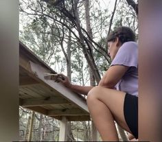 a woman is working on the roof of her house