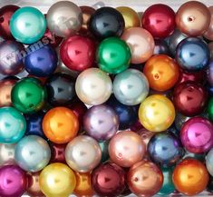 a box filled with lots of different colored balls