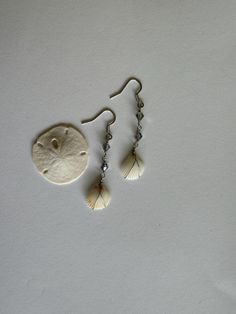 White shells dangled with Swarovski beading and silver wire wrapping, handmade with shells found on the island of Kauai, Hawaii. Beachy Earrings, White Shells, Seashell Earrings, Kauai Hawaii, Shell Jewelry, Shell Earrings, Jewelry Earrings Hoops, Kauai, Silver Wire