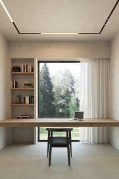 a desk with a laptop on it in front of a window and bookshelves