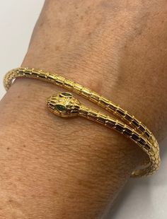 Vintage snake bangle bracelet 9k gold filled Adjusts to fits a small to average wrist All jewelry is shipped free in the US in a nice gift box. Check out our over a THOUSAND great reviews Engraving is $4 per letter and is not always perfect depending on the piece. It can take a few days if the jeweler is busy. This is payable to Paypal Judithsltd@gmail.com Gold Snake Bracelet, Classic Gold-tone Bangle As Gift, Adjustable Gold Snake-shaped Jewelry, Gold Flexible Snake Chain Bracelet, Elegant Snake-shaped Bangle As Gift, Elegant Snake-shaped Bangle For Gift, Yellow Gold Snake Chain Bracelet Gift, Elegant Snake Shape Bangle Gift, Yellow Gold Beaded Bracelet As A Gift