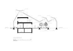 an architectural drawing of a house with several sections labeled in black and white on the side