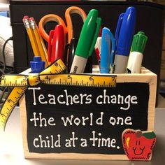 there is a sign that says teachers can change the world one child at a time