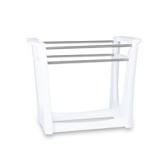 a white bathroom shelf with two towel racks