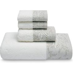 four white towels stacked on top of each other