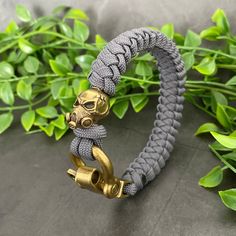 Gas Mask Bead Bracelet - features a brass gas mask skull bead and brass coloured shackle. I only use US manufactured, military grade, 100% nylon, Paracord to ensure the highest quality of my products. The perfect gift for anyone looking for a rugged bracelet. The shackle has 3 holes to adjust the size. For sizing, measure your wrist without any gaps or slack, select that measurement as the bracelet length and I will add the extra to ensure it fits. If your size or desired colour isn't listed please contact me and I will be more than happy to help. https://www.etsy.com/listing/737451366/wild-boar-paracord-bracelet-with?ref=shop_home_active_6 https://www.etsy.com/listing/763575768/werewolf-paracord-bracelet-with-bespoke?ref=shop_home_active_2 Paracord Bead Bracelet, Adjustable Durable Gold Bracelets, Durable Adjustable Wristband Bracelet, Adjustable Silver Paracord Bracelets, Adjustable Gold Paracord Bracelets, Adjustable Gold Paracord Bracelet, Mask Bead, Paracord Bracelet Patterns, Paracord Ideas