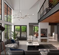 a living room filled with lots of furniture next to tall windows on the side of a wall