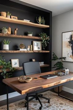 a home office with black walls and shelving above the desk is decorated with potted plants