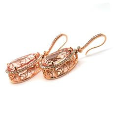 Enhance your jewelry collection with these stunning earrings featuring natural morganites set in warm 14K rose gold. Each earring showcases two beautiful morganites, totaling 15.54 carats, which exude a captivating pink-orange hue.  Earring Highlights: Total Carat Weight: 15.54 carats of radiant morganites, offering a bold and striking appearance. Shape: Pear-shaped, adding an elegant and elongated look. Dimensions: 18.26 x 10.8 x 7.71 mm, providing the ideal size to highlight the gemstone’s beauty. Color: Pink-orange, known for its enchanting and vibrant shade. Color Intensity: Strong, ensuring a vivid and eye-catching display. Clarity: Very eye clean, showcasing a clear and brilliant appearance. Cut: Brilliant/Step cut, designed to enhance the natural sparkle of the morganites. Treatment Luxury Rose Gold Oval Earrings, Elegant Pink Gold Morganite Jewelry, Elegant Rose Gold Morganite Jewelry, Salmon Color, Rose Gold Metal, Stunning Earrings, Rose Gold Earrings, Morganite, Earrings Set