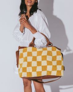 Our newest and exclusive collection! The Checkered Weekender in Honey is a fun neutral travel bag perfect to keep up with all of your activities. The leather wrapped handles combined with a long shoulder strap makes for a bag that is perfect for holding all of your weekend trip needs. It will have you planning your next road trip with the girls in no time. Shop Weekender Bags Now. Weekender Bags, Leather Weekender, Weekend Travel Bags, Weekend Trip, Pocket Bag, Weekend Trips, Leather Wraps, Fun Prints, Weekender Bag