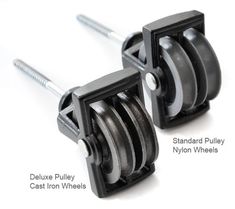 two black pulleys with metal wheels attached to them