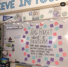 a bulletin board with post it notes attached to it