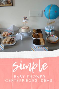 baby shower centerpieces displayed on table with hot air balloon and other items in background