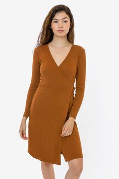 This classic wrap dress is made of a 2x1 ribbed heavy cotton spandex, with a feminine drape and stretch. This dress features long sleeves, an integrated front slit and a-line mid-length skirt and comes with a long tie that can be worn to the front or back. Perfect for date nights but also casual enough for everyday wear. Try pairing with tights and heels or a matching wrap coat. We recommend sizing down in this style if you prefer a more fitted look. This item is a garment dye product. Garment d Wrap Dress Styles, Tights And Heels, Ginger Dress, Cherry Dress, Date Nights, Wrap Coat, Mid Length Skirts, Black Wrap Dress, Lovely Dresses