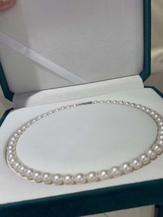 This 7.5-8mm Japanese Akoya Pearl Necklace features genuine, round, high-quality pearls with a beautiful luster and slight pink overtones. The surface may show minor imperfections due to natural growth patterns, but this only adds to the unique charm of these exquisite saltwater pearls. Single Strand Pearl Necklace Gift, Single Strand Round Pearl Necklace Gift, Single Strand Round Pearl Necklace As Gift, Pearl White Round Pearl Necklace For Gift, White Gold Pearl Necklace, Akoya Pearl Necklace, Saltwater Pearls, Akoya Pearls, Unique Charms