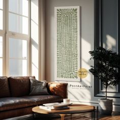 a living room with a couch, coffee table and potted plant