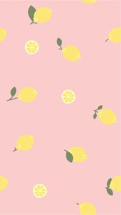 a pink background with lemons and leaves