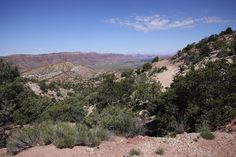 there is a view of the mountains and water from this hill side hike in arizona