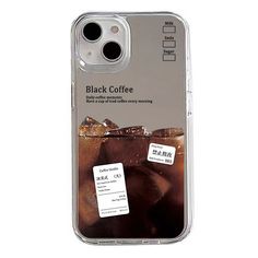 an iphone case with a black coffee drink on the front and two stickers attached to it