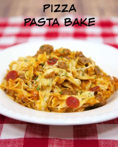 a white plate topped with pasta covered in cheese and pepperoni sauce next to a red checkered table cloth