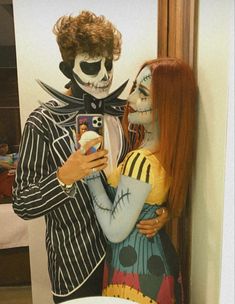 a man and woman dressed up as jack skellingy and the skeleton from it's movie