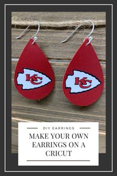 two red tear shaped earrings with the word make your own nfl team logo on them