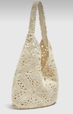 a crocheted bag is shown on a white background