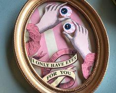 an image of two hands with fake eyeballs in a gold frame that says, only have eyes for you