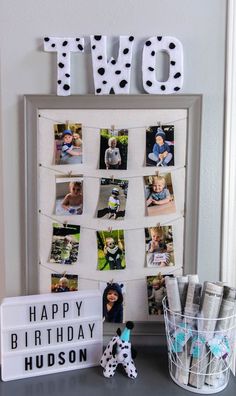 a birthday card holder with photos on it and the word love spelled in white letters