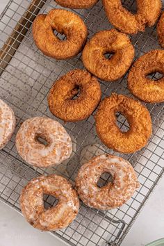 there are many donuts on the cooling rack