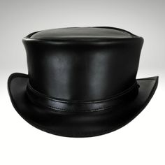 Mens Black Leather Top Hat - Made with genuine leather.  We presents the sleek and streamlined Black Leather Top Hat for those who prefer a simpler design.  Cowhide suede, a narrow self-leather Black Leather Top Hat strap adorns the short pointed crown.  This leather item is handmade with cowhide leather and is from expert craftsmen.  This is a stylish and durable item. Our products are of the highest quality. We guarantee satisfaction. Fitted Leather Top Hat With Short Brim, Leather Riding Hat With Curved Brim, Leather Hat With Curved Brim For Riding, Leather Curved Brim Riding Hat, Classic Leather Hat With Flat Bill, Black Leather Hat With High Crown, Leather Flat Brim Hat With Leather Lining, Fitted Leather Hat With Short Brim, Classic Leather Flat Bill Hat