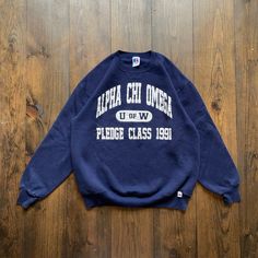 Vintage 1991 Alpha Chi Omega University Fraternity Sorority College Varsity Crewneck Sweatshirt / made in USA / size XL Pit to Pit:      22" Length:      26" Sleeve:       30" Please check the measurements before purchasing.  -------------------------------- ⚠️ Please Note: All of our items are vintage. Please note that with vintage clothing, items may show some signs of wear. We do our best to include as much information about the items condition as possible. Please look carefully through the p Vintage Oversized Tops With Lettering, Vintage Oversized Top With Lettering, Vintage Graphic Print Top For Campus, Vintage Crew Neck Tops For Campus, Vintage College Sweatshirt With Text Print, Vintage Sweatshirt With Letter Print For Campus, Varsity Crewneck, Tri Delt, Rare Clothing