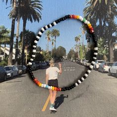 glass seed bead bracelet with black, white and rainbow pattern strung on elastic please gently roll off and on to prolong its life handmade in venice, ca Black Seed Bead Bracelet, Aesthetic Seed Bead Bracelets, Cool Beaded Bracelets, Seed Bead Bracelets Ideas, Small Bead Bracelets Ideas, Seed Bead Necklace Patterns, Seed Bead Bracelet Ideas, Glass Bead Bracelet Ideas, Beaded Bracelet Aesthetic