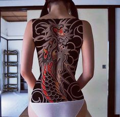 a woman with a tattoo on her back