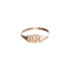 DESIGNER Ariel Gordon MATERIALS 14k Yellow Gold DESCRIPTION The Petite Signet Ring is delicate, chic, and destined for heirloom status. Customize yours with our signature script font on this timeless hand-engraved design. Height measures 1/8" ENGRAVING This piece comes with complimentary engraving of up to 2 characters. In order to prevent any confusion, please enter in the letters in the order you would like them to be engraved. The ring comes with up to three letters. Due to its custom nature, Gold Face, Gold Signet Ring, Everyday Rings, Script Font, Hand Engraving, Signet Ring, Ariel, Rose Gold Ring, Gold Jewelry