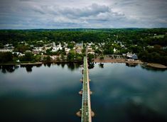 an aerial view of a bridge over a body of water