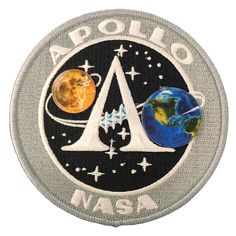 an embroidered patch with the letter a and two planets on it, in front of a white background