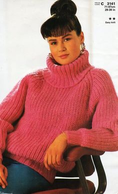 a woman in a pink sweater sitting on a chair with her hand on her hip