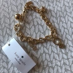 Adorable Kate Spade Bridal Charm Bracelet!! Brand New. Dust Bag And Box Can Be Sent By Request As Well. Elegant Gold-tone Charm Bracelet With Logo, Elegant Charm Bracelet With Logo Charm As Gift, Kate Spade Gold Bracelet Jewelry, Kate Spade Gold Bracelets, Kate Spade Gold Bracelet, Kate Spade Bridal, Kate Spade Bracelet, Kate Spade Bangle, Classic Bangles