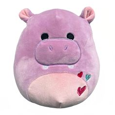 a purple hippo stuffed animal with hearts on its nose