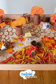 a wooden tray filled with lots of different types of food and decorations on top of it