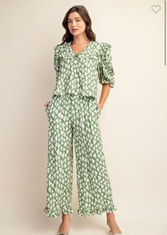 True to size, I am an 8/10 wearing a medium. Ruffled collar button down top with puff sleeves and matching pants. Pants feature elastic waist and side pockets. 84% rayon, 17% nylon. Small 4-6Medium 8-10Large 12-14 Top With Puff Sleeves, Ruffled Collar, Matching Pants, Green Cream, Dress Accessories, Puff Sleeves, Puff Sleeve, Button Downs, Elastic Waist