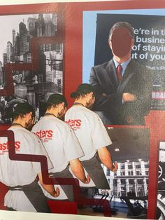 three men in white t - shirts and black hats are looking at a large poster