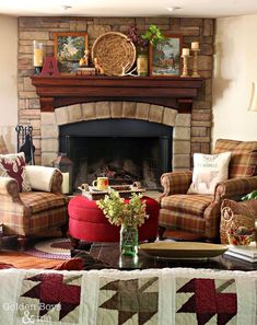 a living room filled with furniture and a fire place in front of a brick fireplace