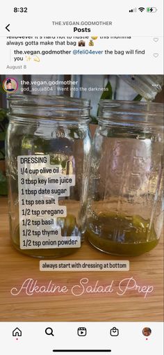 two jars filled with liquid sitting on top of a wooden table next to each other