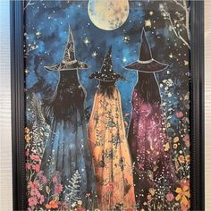 three witches walking in the night sky with flowers and stars on their heads, one wearing a witch's hat